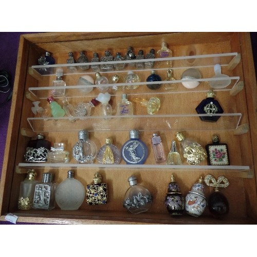 75 - APPROX 45 X MINIATURE PERFUME BOTTLES, DISPLAYED IN A WOODEN/PERSPEX CABINET.