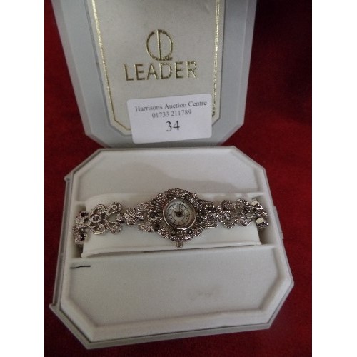 34 - LADIES DECORATIVE SILVER METAL WATCH