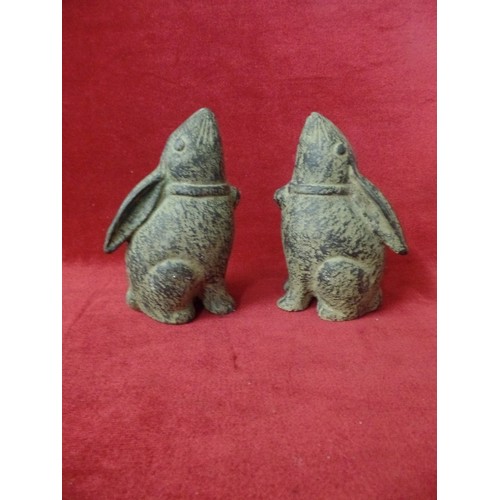 81 - A PAIR OF HEAVY CAST METAL HARES/RABBITS.