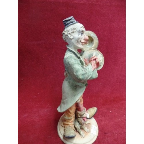 208 - LOVELY CERAMIC CLOWN FIGURE. PLAYING CYMBALS, HAS A MONKEY AT HIS FEET.