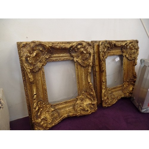 128 - A PAIR OF HEAVY-GILT GLAZED FRAMES. SOME CRACKS ARE VISIBLE.