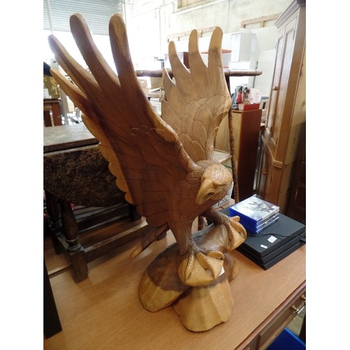 254 - VERY LARGE CARVED WOODEN EAGLE. WORKED FROM 1 SOLID PIECE OF OAK. TAIL FEATHER HAS BEEN REPAIRED.