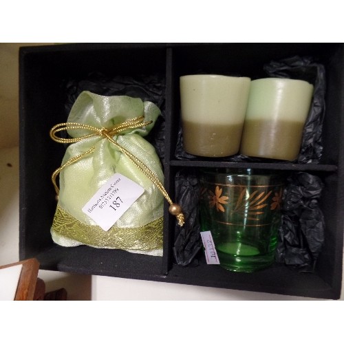 187 - VOTIVE-CANDLE GIFT SET, BOXED, TOGETHER WITH A DECORATIVE CARVED WOODEN BOX, WITH ORIENTAL CHARACTER... 