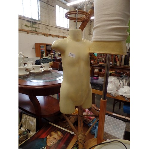 313 - 2 X RETAIL MANNEQUINS. CHILDSIZE. 1 HAS A HANGING HOOK, AND THE OTHER ON A PEDESTAL BASE.