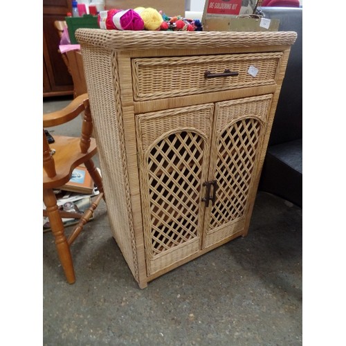 325 - WICKER/CANE CABINET. 2 X OPEN WEAVE DOORS, WITH THE REST BASKET WEAVE. 2 INNER SHELVES & A TOP DRAWE... 