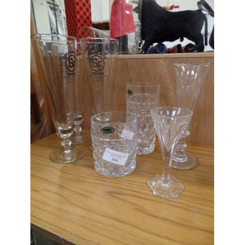 384 - GLASSWARE. INC TALL SOUTHFORK RANCH FLUTES, LEAD CRYSTAL ETC.