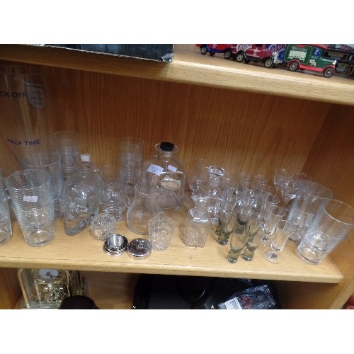 378 - SHELF FULL OF GLASSWARE. INC MODERN DECANTERS, SKULL DECANTER, FAMOUS GROUSE MEASURES, SHOT GLASSES ... 