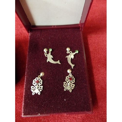 19 - 2 PAIRS OF SILVER EARRINGS SILVER METAL DOLPHIN EARRINGS AND SILVER METAL BUTTERFLY EARRINGS