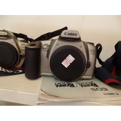 85 - 3 X CANON CAMERAS. INC EOS REBEL GII, EOS 3000N, & REBEL 2000 EOS. WITH SHOULDER STRAPS.