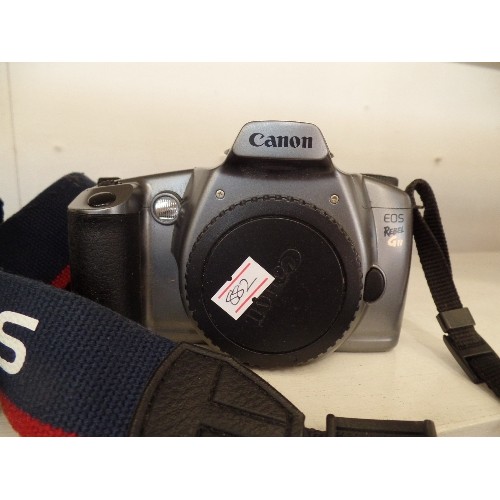 85 - 3 X CANON CAMERAS. INC EOS REBEL GII, EOS 3000N, & REBEL 2000 EOS. WITH SHOULDER STRAPS.