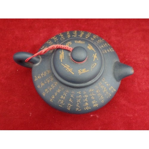 102 - A  FINELY POTTED CHINESE YIXING TEAPOT WITH ALL OVER DECORATION OF CHINESE CALLIGRAPHY. MARKS TO INS... 