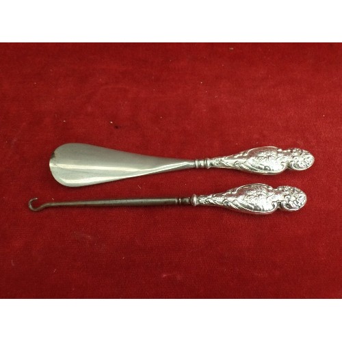 21 - EDWARDIAN SILVER HANDLED BUTTON HOOK AND SHOE HORN - CHERUB DESIGN TO HANDLES