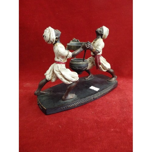 131 - A MODERN RESIN STAND WITH TWO BLACKAMOOR FIGURES