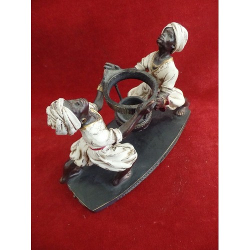 131 - A MODERN RESIN STAND WITH TWO BLACKAMOOR FIGURES