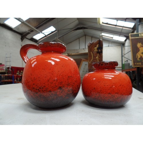 187 - TWO 1960'S WEST GERMAN LAVA VASES IN BRIGHT ORANGE, THE LARGER ONE WITH A HANDLE, NO 484-27