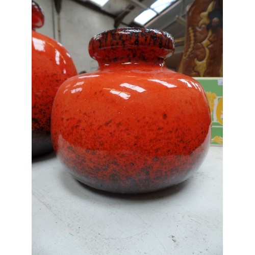 187 - TWO 1960'S WEST GERMAN LAVA VASES IN BRIGHT ORANGE, THE LARGER ONE WITH A HANDLE, NO 484-27