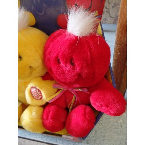 361 - NEW/PACKAGED 'PUT ON A HAPPY FACE-PRESS MY HAND & WE SING' RED & YELLOW SOFT TOYS.