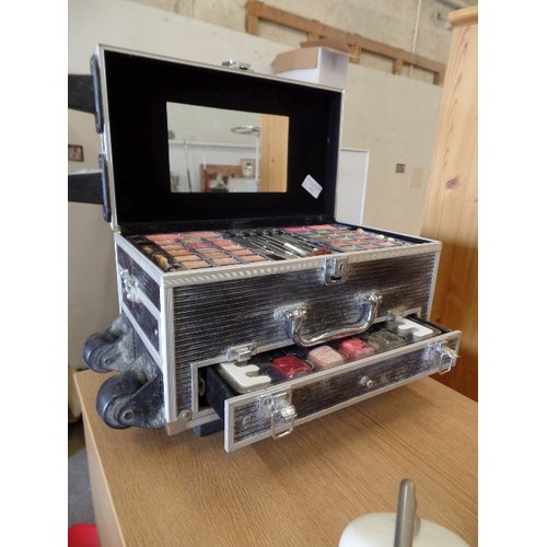 363 - MAKE-UP ARTIST CASE. RIGID STEEL CASE ON WHEELS. FULL OF MAKE-UP, BRUSHES, NAIL POLISH ETC ETC.