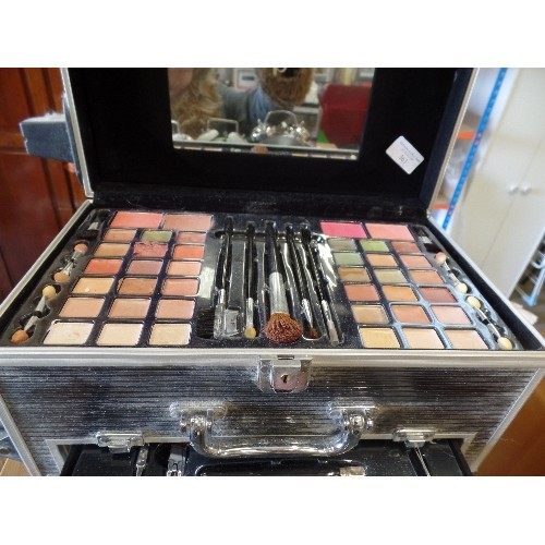 363 - MAKE-UP ARTIST CASE. RIGID STEEL CASE ON WHEELS. FULL OF MAKE-UP, BRUSHES, NAIL POLISH ETC ETC.