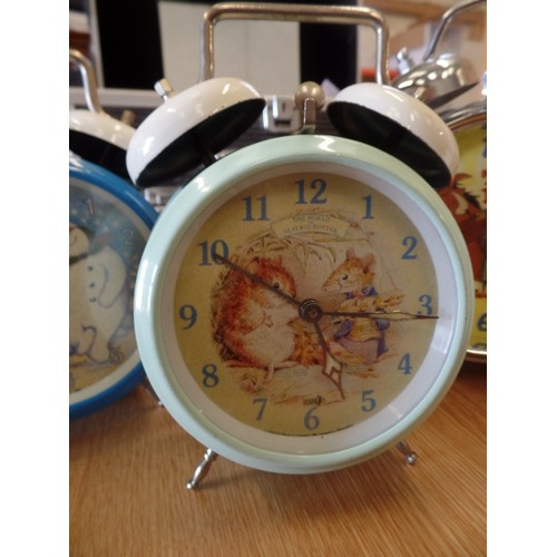 364 - 4 X DISNEY ETC TRADITIONAL ALARM CLOCKS WITH BELLS ON! INC TIMON AND PUMBAA, BEATRIX POTTER, AND THE... 