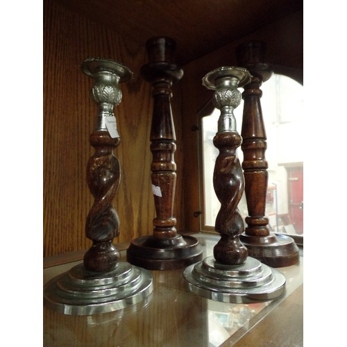 388 - 2 SETS OF VINTAGE TURNED-WOOD CANDLESTICKS. 1 SET HAS 'SILVER METAL' BASE AND TOP.