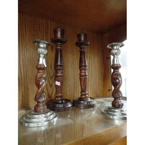 388 - 2 SETS OF VINTAGE TURNED-WOOD CANDLESTICKS. 1 SET HAS 'SILVER METAL' BASE AND TOP.