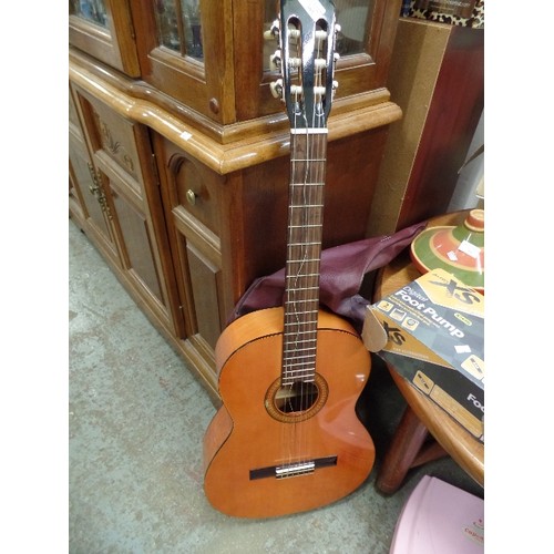 395 - ACOUSTIC GUITAR. KASUGA G 100.L. 1 BROKEN STRING. WITH PROTECTIVE BAG.