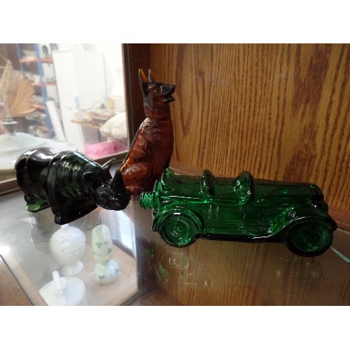 389 - A BROWN GLASS GERMAN SHEPHERD PERFUME DECANTER, TOGETHER WITH A GREEN GLASS RHINO, AND A GREEN GLASS... 