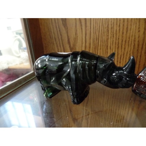 389 - A BROWN GLASS GERMAN SHEPHERD PERFUME DECANTER, TOGETHER WITH A GREEN GLASS RHINO, AND A GREEN GLASS... 