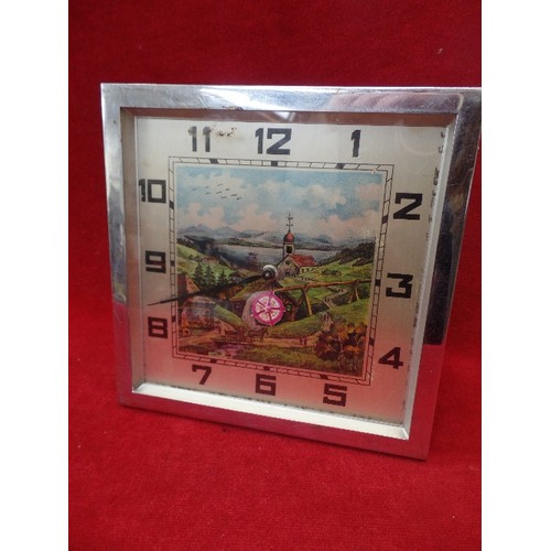 289 - AN UNUSUAL 1950'S CHROME FRAMED CLOCK WITH ALPINE SCENE AND TURNING WATERWHEEL - 18CM SQUARE - WITH ... 