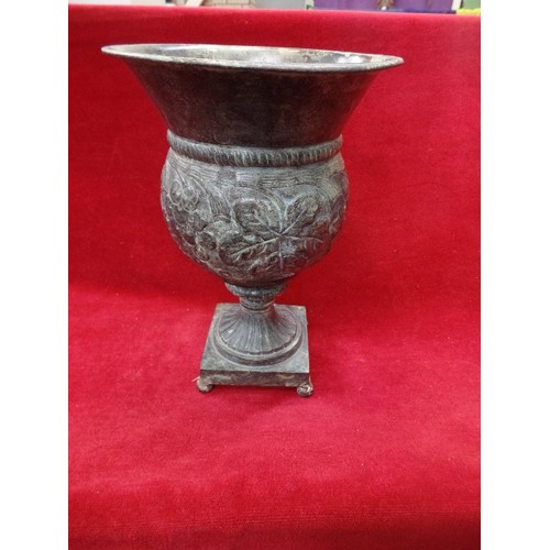 163 - PATINATED BRASS URN WITH GRAPE VINE DESIGN. THE TOP SECTION IN PRESSED BRASS, THE BASE HEAVY SOLID B... 