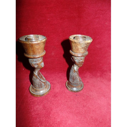 142 - A PAIR OF MID 20TH CENTURY CARVED AFRICAN FIGURE CANDLESTICKS, WITH TOP HATS - 15CM