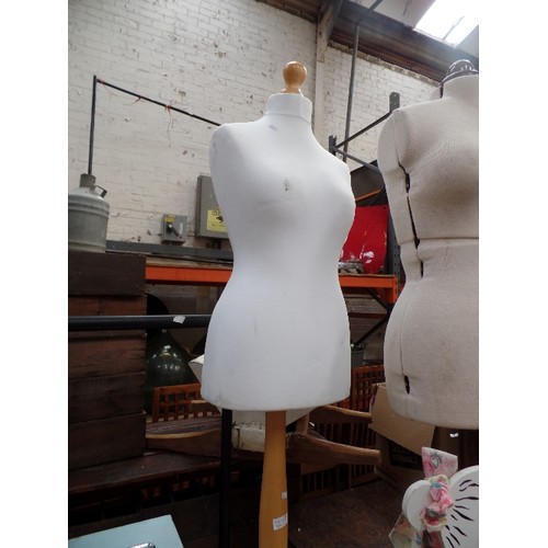 380A - A DRESSMAKER'S MANNEQUIN ON A PALE WOOD STAND