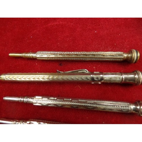 93 - FOUR EARLY 20TH CENTURY SILVER PLATED RETRACTABLE PENCILS WITH ENGINE TURNED ENGRAVING, THREE WITH C... 