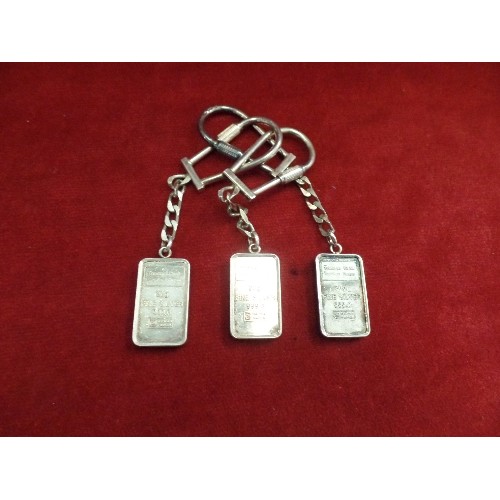 38 - 3 X 999 FINE SILVER BAR KEYRINGS BY THOMAS COOK TRAVELLERS CHEQUES ON ONE SIDE AND ARABIC SCRIPT ON ... 