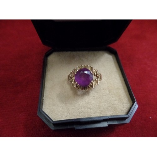 47 - A 9CT GOLD 1970'S BARK RING WITH LARGE BRILLIANT CUT AMETHYST - LONDON HALLMARK. 3.2 GRAMS