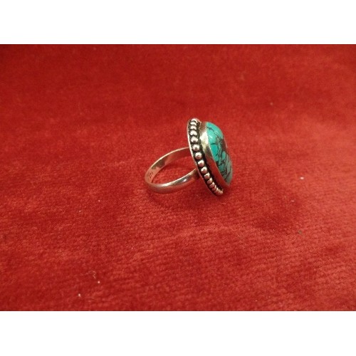 65 - A 925 SILVER RING SET WITH A PEAR DROP SHAPED 