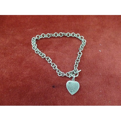 70 - A 925 SILVER BRACELET WITH A HEART CHARM SET WITH A DIAMOND