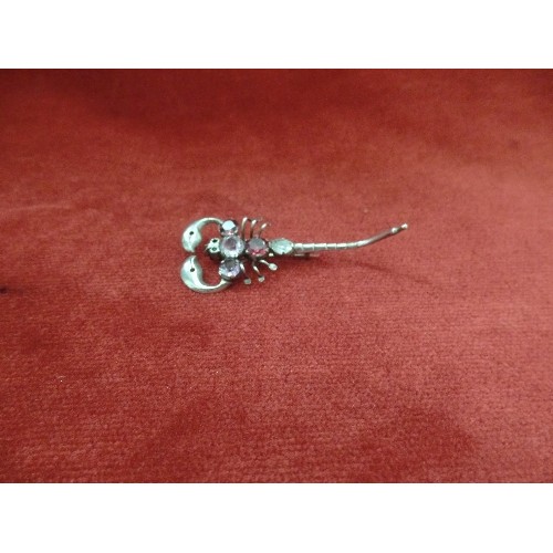 69 - AN EDWARDIAN SILVER METAL SCORPION BROOCH WITH PURPLE COLOURED STONES - WELL MADE PIECE - 7CM