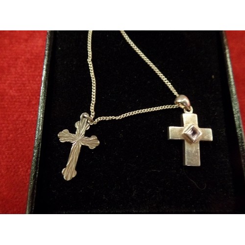 74 - A 925 SILVER CROSS AND CHAIN. ONE CROSS SET WITH AN AMETHYST COLOUR STONE