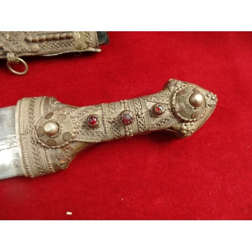 121 - TRADITIONAL MOROCCAN KOPUMMYA DAGGER - THE HANDLE DECORATED WITH WIRE WORK AND INLAID WITH RED BEADS... 