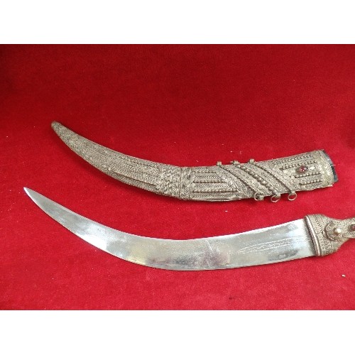 121 - TRADITIONAL MOROCCAN KOPUMMYA DAGGER - THE HANDLE DECORATED WITH WIRE WORK AND INLAID WITH RED BEADS... 