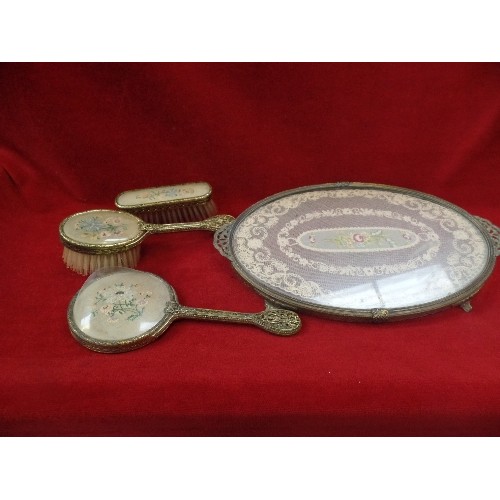 128A - A VINTAGE 1930'S DRESSING TABLE SET WITH PETIT POINT DECORATION INCLUDING TRAY, BRUSHES AND A MIRROR