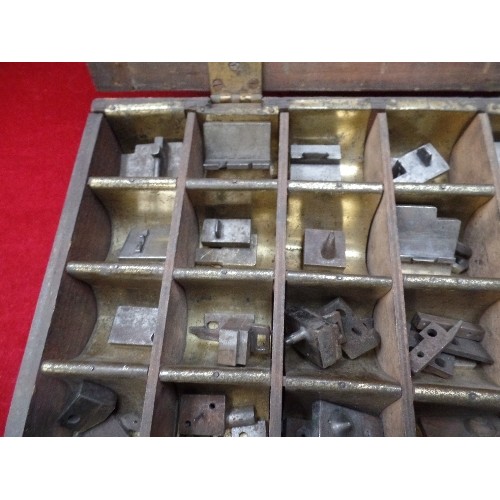 294 - VINTAGE SET OF PRESS DIES OR STAMPS IN A FITTED METAL LINED WOODEN BOX