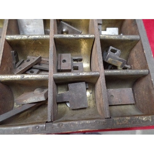 294 - VINTAGE SET OF PRESS DIES OR STAMPS IN A FITTED METAL LINED WOODEN BOX