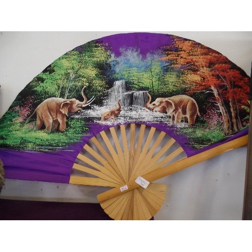 144 - LARGE DECORATIVE FAN. HAND-PAINTED WITH ELEPHANTS PLAYING IN WATERFALL.