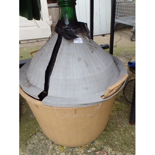 328 - VERY LARGE GREEN VINTAGE GLASS CARBOY/DEMIJOHN/WINE FERMENTER. CONTAINED IN PLASTIC BASKET [WHICH IS... 