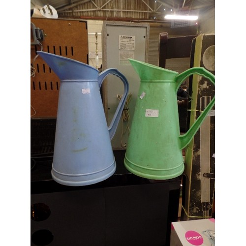 511 - 2 X PLASTIC FUEL JUGS, IN BLUE AND GREEN.