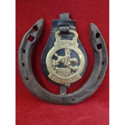 535 - TALLY-HO HORSE BRASS, ON LARGE HORSE SHOE, ALSO HEAVY LEATHER AND BRASS TACK ITEMS.