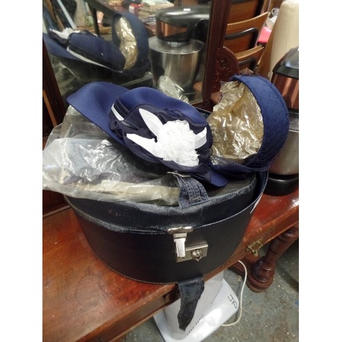 612 - HAT BOX, WITH 3 HATS. KANGOL NAVY HAT WITH FLOWERS, NAVY PILL BOX HAT.